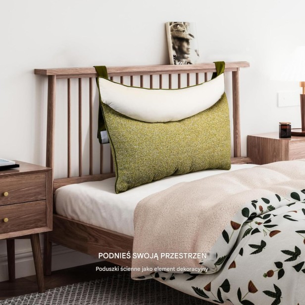 Grafika przedstawia pojedynczą poduszkę zagłówkową w zaaranżowanej sypialni.