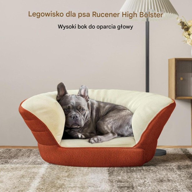 Pies leży w dużym, podwyższonym legowisku dla psa w kolorze terakota i beż.