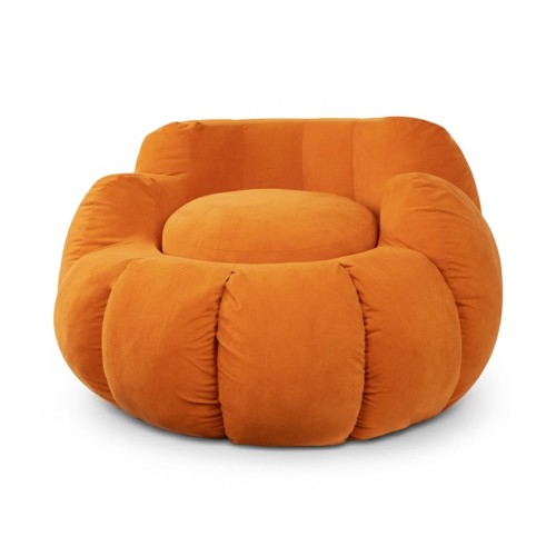 Pufa pokryta luksusowym welurem w kształcie dyni.